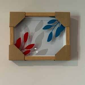 Red and Blue Leaf Art in Wooden Frame